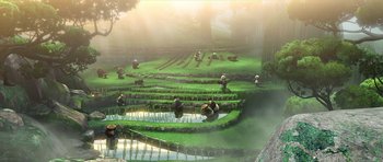 Movie still from “Kung Fu Panda 2” (2011), directed by Jennifer Yuh Nelson – A group of people sitting in a field with a pond; Extreme Wide shot, High angle