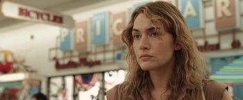 Movie still from “Labor Day” (2013), directed by Jason Reitman – A person with long hair; Close Up shot, Over the shoulder angle