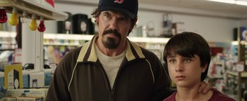 Movie still from “Labor Day” (2013), directed by Jason Reitman – A person wearing a hat; Close Up shot, Over the shoulder angle