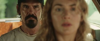 Movie still from “Labor Day” (2013), directed by Jason Reitman – A man and a woman looking at the camera; Close Up shot, Over the shoulder angle