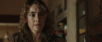 Movie still from “Labor Day” (2013), directed by Jason Reitman – A person with curly hair; Close Up shot, Over the shoulder angle