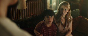 Movie still from “Labor Day” (2013), directed by Jason Reitman – A boy and a woman sitting in a living room; Close Up shot, Over the shoulder angle