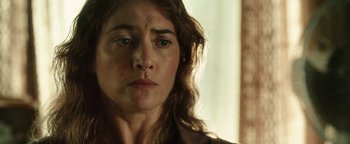 Movie still from “Labor Day” (2013), directed by Jason Reitman – A woman's face in front of a window; Close Up shot, Over the shoulder angle