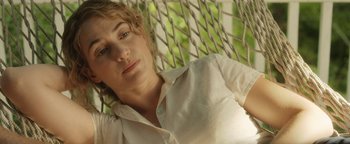 Movie still from “Labor Day” (2013), directed by Jason Reitman – A woman in a white shirt is laying in a hammock; Close Up shot, Over the shoulder angle