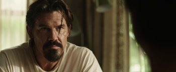 Movie still from “Labor Day” (2013), directed by Jason Reitman – A person with a beard; Close Up shot, Over the shoulder angle