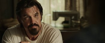 Movie still from “Labor Day” (2013), directed by Jason Reitman – A person sitting in a room; Close Up shot, Over the shoulder angle