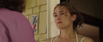 Movie still from “Labor Day” (2013), directed by Jason Reitman – A person looking at the camera; Close Up shot, Over the shoulder angle