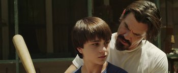 Movie still from “Labor Day” (2013), directed by Jason Reitman – A young man with a beard and a man with a beard; Close Up shot, Over the shoulder angle