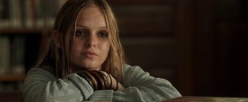 Movie still from “Labor Day” (2013), directed by Jason Reitman – A girl with bracelets is posing for a picture; Close Up shot, Low angle