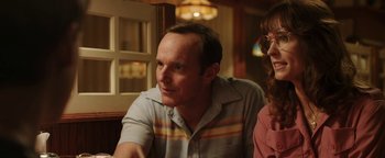 Movie still from “Labor Day” (2013), directed by Jason Reitman – A man and a woman sitting at a table in front of a window; Close Up shot, Over the shoulder angle