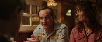 Movie still from “Labor Day” (2013), directed by Jason Reitman – A person sitting at a table; Close Up shot, Over the shoulder angle