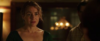 Movie still from “Labor Day” (2013), directed by Jason Reitman – A person standing in front of a mirror; Close Up shot, Over the shoulder angle