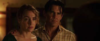 Movie still from “Labor Day” (2013), directed by Jason Reitman – A man and a woman standing next to each other; Close Up shot, Over the shoulder angle