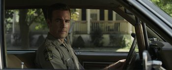 Movie still from “Labor Day” (2013), directed by Jason Reitman – A man sitting in the drivers seat of a car; Close Up shot, Over the shoulder angle