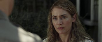 Movie still from “Labor Day” (2013), directed by Jason Reitman – A person with long blonde hair; Close Up shot, Over the shoulder angle