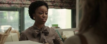 Movie still from “Labor Day” (2013), directed by Jason Reitman – A woman sitting at a desk in a room; Close Up shot, Over the shoulder angle