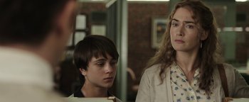 Movie still from “Labor Day” (2013), directed by Jason Reitman – Two people standing next to each other in a room; Close Up shot, Over the shoulder angle