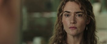 Movie still from “Labor Day” (2013), directed by Jason Reitman – A woman's face in a room; Close Up shot, Over the shoulder angle