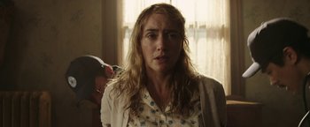 Movie still from “Labor Day” (2013), directed by Jason Reitman – A person with long hair; Close Up shot, Over the shoulder angle