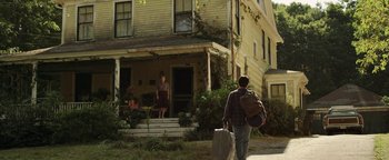Movie still from “Labor Day” (2013), directed by Jason Reitman – A man walking down the street with a suitcase; Wide shot, Low angle