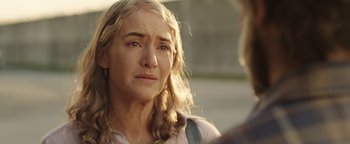 Movie still from “Labor Day” (2013), directed by Jason Reitman – A person with long blonde hair; Close Up shot, Over the shoulder angle