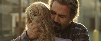 Movie still from “Labor Day” (2013), directed by Jason Reitman – A man and a woman embracing each other; Close Up shot, Over the shoulder angle