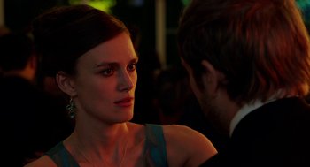Movie still from “Laggies” (2014), directed by Lynn Shelton – A woman in a blue dress is talking to a man in a black suit; Close Up shot, Over the shoulder angle