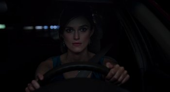 Movie still from “Laggies” (2014), directed by Lynn Shelton – A woman sitting in the drivers seat of a car at night; Close Up shot, Over the shoulder angle