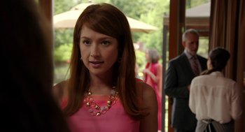 Movie still from “Laggies” (2014), directed by Lynn Shelton – A woman in a pink dress and a gold necklace; Medium shot, Over the shoulder angle