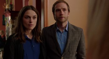 Movie still from “Laggies” (2014), directed by Lynn Shelton – A man and a woman standing next to each other; Medium shot, Over the shoulder angle
