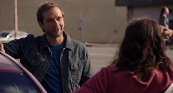 Movie still from “Laggies” (2014), directed by Lynn Shelton – A man and a woman talking on the sidewalk; Close Up shot, Over the shoulder angle