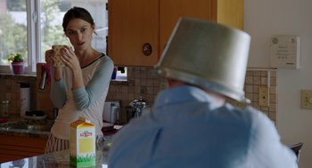 Movie still from “Laggies” (2014), directed by Lynn Shelton – A woman is looking at a man in a silver hat; Medium shot, Over the shoulder angle