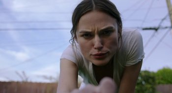 Movie still from “Laggies” (2014), directed by Lynn Shelton – A person laying on the ground looking at the camera; Close Up shot, Low angle