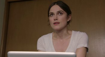 Movie still from “Laggies” (2014), directed by Lynn Shelton – A woman sitting in front of a laptop computer; Close Up shot, Over the shoulder angle