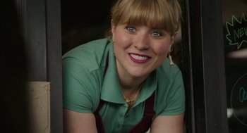 Movie still from “Laggies” (2014), directed by Lynn Shelton – A woman wearing a green shirt and a red apron; Close Up shot, High angle