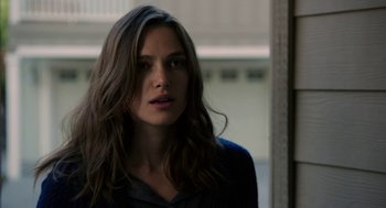 Movie still from “Laggies” (2014), directed by Lynn Shelton – A beautiful young woman with long , brown hair; Close Up shot, Over the shoulder angle