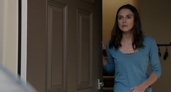 Movie still from “Laggies” (2014), directed by Lynn Shelton – A woman standing in front of a door; Medium shot, Over the shoulder angle