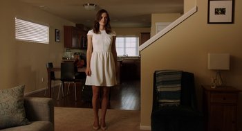 Movie still from “Laggies” (2014), directed by Lynn Shelton – A woman in a white dress standing in a room; Wide shot, Low angle