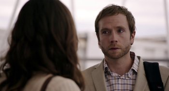 Movie still from “Laggies” (2014), directed by Lynn Shelton – A man and a woman looking at one another in the mirror; Close Up shot, Over the shoulder angle