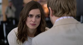 Movie still from “Laggies” (2014), directed by Lynn Shelton – A woman looking at a man in a white suit; Close Up shot, Over the shoulder angle