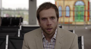 Movie still from “Laggies” (2014), directed by Lynn Shelton – A person wearing a suit and tie; Close Up shot, Over the shoulder angle