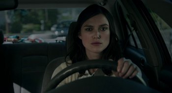 Movie still from “Laggies” (2014), directed by Lynn Shelton – A woman sitting in the driver's seat of a car; Close Up shot, Over the shoulder angle