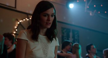 Movie still from “Laggies” (2014), directed by Lynn Shelton – A beautiful young lady wearing a white dress; Close Up shot, Over the shoulder angle