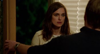 Movie still from “Laggies” (2014), directed by Lynn Shelton – A person sitting in front of a window; Close Up shot, Over the shoulder angle