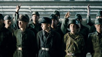 Movie still from “Land of Mine” (2015), directed by Martin Zandvliet – A group of men in military uniforms standing next to each other; Medium shot, Low angle