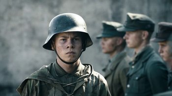 Movie still from “Land of Mine” (2015), directed by Martin Zandvliet – A group of men standing next to each other wearing uniforms; Close Up shot, Low angle