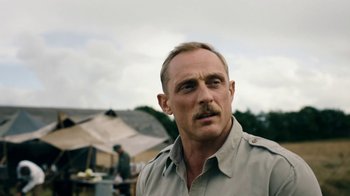 Movie still from “Land of Mine” (2015), directed by Martin Zandvliet – A person with a mustache; Close Up shot, Over the shoulder angle