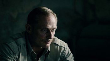 Movie still from “Land of Mine” (2015), directed by Martin Zandvliet – A person with a mustache; Close Up shot, Over the shoulder angle