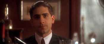 Movie still from “Last Man Standing” (1996), directed by Walter Hill – A man in a suit and a tie; Close Up shot, Low angle