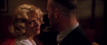 Movie still from “Last Man Standing” (1996), directed by Walter Hill – A man and a woman looking at one another; Close Up shot, Over the shoulder angle